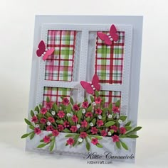 a card with flowers and butterflies on the window sill in front of a white background