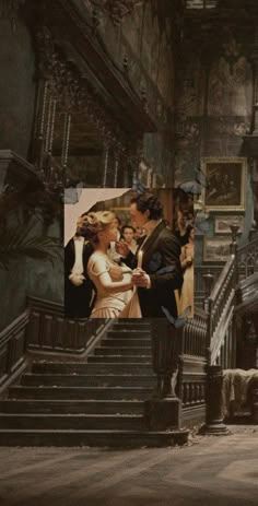 a bride and groom are kissing on the stairs