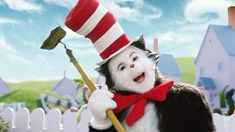 the cat in the hat is holding a broom