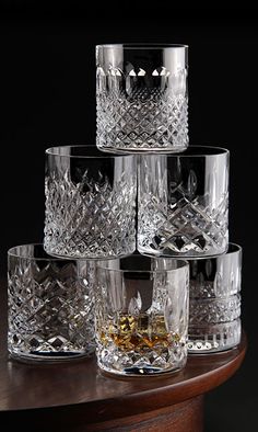 four crystal tumblers stacked on top of each other