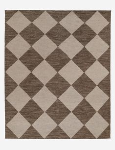 a brown and white rug with squares on it