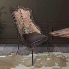 a brown chair sitting next to a wooden table