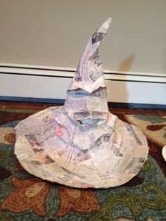 a paper hat sitting on top of a rug