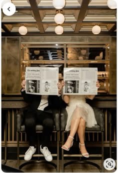 two people sitting on a bench holding up newspapers in front of their faces with the same person reading them