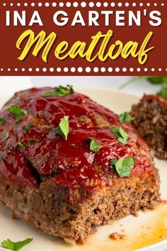 meatloaf on a plate with sauce and garnish