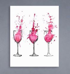 three wine glasses with pink paint splattered on them