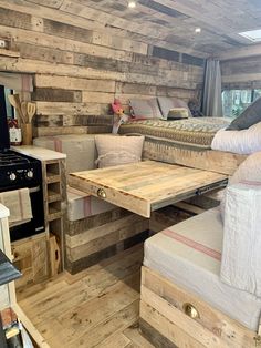 a living area with wooden walls and furniture