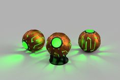 three glowing balls with green lights on them