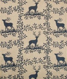 a rug with deers and trees on it