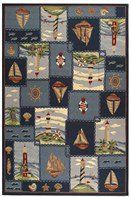 an area rug with sailboats and lighthouses on it