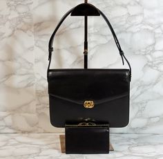 This vintage Gucci bag shoulder measures approximately 7” x 9” x 3”. This is a used bag with minimal wear. Please closely inspect all photos before purchasing. Closure: Push Lock Strap Drop: 14” Color: Black Pockets: 2 Interior & 0 Exterior Material: Leather Style: Shoulder Bag Photos are Actual pictures, not stock photos. Authenticity Note: We have been trained to spot fake designer bags, and closely inspect each purse to verify authenticity. If we have any doubts, we NEVER sell it. That said, Gucci Vintage Bag, Fake Designer Bags, Gucci Purse, Baby Beanie, Leather Fashion, Gucci Bag, New Product, Vintage Gucci, Brown Leather