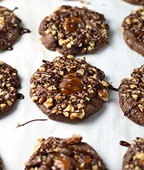 chocolate cookies with nuts and caramel on top