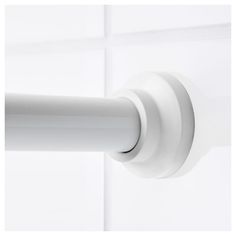 a white door handle on the side of a wall