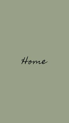 the word home written in cursive writing on a light green background with black ink