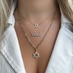 Inspire your faith with this elegant 14K gold diamond Star of David necklace charm. The large size is sure to sparkle with a radiant shine, perfect for expressing your faith with timeless style. The six sided figure symbolizes protection from all six directions: north, south, east, west, up, and down with the middle - the hexagram - providing the spiritual dimension. Enhancer clasp included. Chain sold separately. Item Information Metal: 14k Gold Weight: 2.3g Dimensions: 20mm Diamond Information Star Of David Necklace Aesthetic, Star Of David Jewelry, Star Of David Gold Necklace, Magen David Necklace, Body Jewelry Men, North South East West, Jewish Star Necklace, David Star, Star Of David Necklace