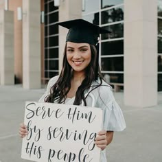 a woman in graduation cap and gown holding a sign that says serve him by serving his people