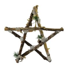 a wooden star ornament with snow on it