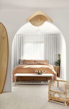 a bedroom with a surfboard on the wall