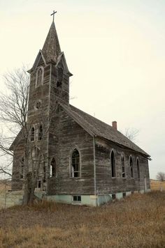 an old wooden church in the middle of nowhere