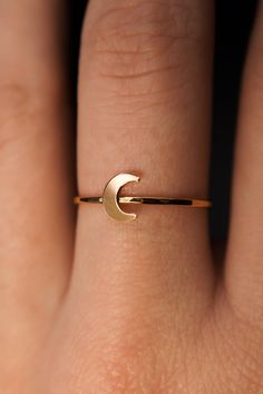 Dive into the celestial charm of our Moon Ring! The lunar-inspired design features a dainty moon on a simple, textured band - providing an adorable accent to any stack. The band measures approximately 1mm in width and features a lightly hammered finish. The moon detail measures approximately 6mm in width. This listing is for ONE SINGLE Moon Ring in 14K GOLD FILL metal. This ring is a great alternative to a stacking ring and is a perfect ring to mix and match with your favorite stacking rings. Every piece is organic and unique — no two Hannah Naomi pieces are exactly alike.Hand-crafted to order in our Portland, OR studio. Moon Ring, Stacking Ring, Perfect Ring, Cleaning Jewelry, Stacking Rings, Metal Jewelry, The Moon, Design Features, Portland