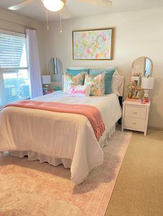 a bedroom with a bed, dresser and window