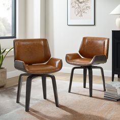 two brown leather chairs sitting next to each other on top of a carpeted floor