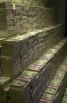 stacks of money sitting on top of each other