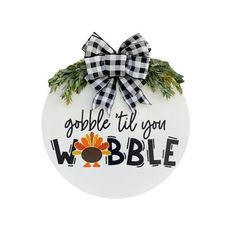 a ceramic ornament with the words gobble til you wobble on it