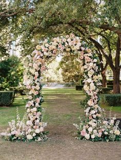 an arch made out of flowers and greenery