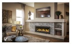 a living room filled with furniture and a fire place