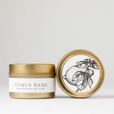 a jar of citrus basil body scrub next to a gold tin