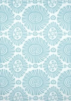 a blue and white wallpaper with an intricate design