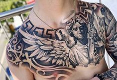 a man with an angel tattoo on his chest