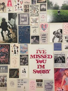 a wall covered in posters and stickers with the words i've missed you, i'm sorry