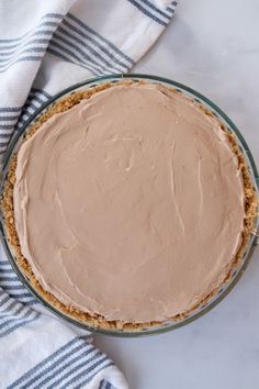 a pie sitting on top of a table covered in frosting