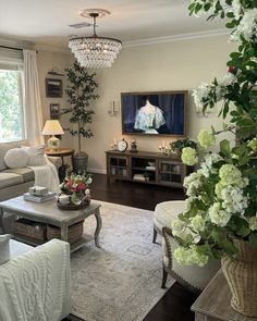 a living room filled with furniture and a flat screen tv