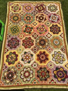 a large multicolored rug on the ground