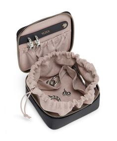 This luxe leather jewelry case is designed to organize earrings, necklaces and rings when traveling or on-the-go. With the option of complimentary monogramming, it makes the perfect gift. Organize Earrings, Travel Jewelry Holder, Necklaces And Rings, Earring Hole, Best Stocking Stuffers, Luggage Covers, Earring Organizer, Travel Kit, Luxury Towels