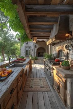 an outdoor kitchen with lots of wood and stone counter tops, built into the ceiling