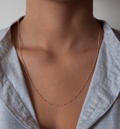 One of our favorite necklaces is the beaded satellite chain. This delicate curb chain is dotted with tiny 2mm beads every 14mm. We love this chain as a single or wrapped around twice as a double. Choose your own perfect length. Details: 14k solid gold chain 14k solid gold clasp * in the images you can see the necklace as a 14, 16,18 and 36-inch examples. The double wrapped necklace is 36 inches. We take pride in offering our customers the very best in fine jewelry. That's why we create stunning Minimalist Tiny Beads Chain Necklace For Everyday, Dainty Rose Gold Chain Necklace For Layering, Minimalist Tiny Beaded Necklaces For Layering, Delicate Rose Gold Chain Necklace For Layering, Dainty Yellow Gold Station Necklace With Satellite Chain, Dainty Rose Gold Necklace With Paperclip Chain, Dainty Everyday Satellite Chain Necklace, Delicate Jewelry With Tiny Beads For Layering, Dainty Rose Gold Paperclip Chain Necklace