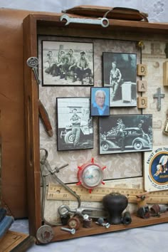 an old suitcase is covered with pictures and memorabilia