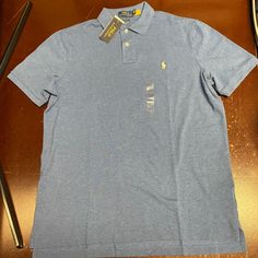 Polo Ralph Lauren Mens Blue Short Sleeve Collared Classic Fit Polo Shirt Large Brand: Polo Ralph Lauren Department: Men Color: Blue Size: Large Type: Polo Theme: Classic Neckline: Collared Features: Breathable Comfort Closure: Button Occasion: Casual Season: All Seasons Condition: New With Tags I Offer Discounts For All Return Customers. - Jvs Blue Slim Fit Collared Top, Classic Light Blue Polo Collar Top, Blue Slim Fit Cotton Tops, Blue Cotton Polo Shirt, Ralph Lauren Nyc, Blue Shorts Men, Spandex Shirts, Polo Sport Ralph Lauren, Polo Ralph Lauren Shorts