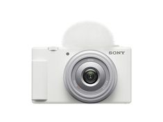 a white camera with a lens attached to it's front cover and the words sony on