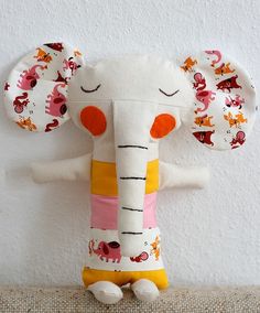 an elephant stuffed animal with its eyes closed