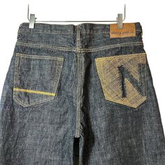 Vintage Nautica Men's Embroidered Logo Raw Hem Indigo Blue Jeans Size 34 X 34. Tan logo embroidered back pockets, raw hem. Classic button & zip fly closure.  Size - 34 X 34 Color - Blue, tan Condition - Pre-owned Approx. Measurements Flat Across: Across the waist - 16.5 in Length (from the top of the waist to the bottom hem) - 40 in Inseam - 28 in Rise - 12.5 in D3-9051 Sean John Jeans, Sean John, Indigo Blue, Logo Embroidered, Mens Bottom, Vintage Men, Blue Jeans, Mens Jeans, Jeans Size