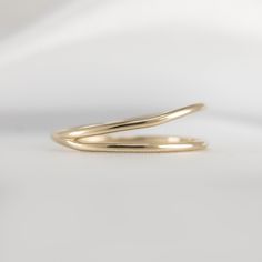 Get ready to admire the exquisite design of our Double Row Open Ring! The two layers of gold wires are intertwined flawlessly to create a polished piece that will make you shine. Crafted from 14K gold, this stunning ring is guaranteed to bring joy to your life. So go ahead and treat yourself by adding this exceptional piece to your collection! Metal: 14K yellow Gold Dimensions: 6.5mm at widest, 1.2mm wire Modern Yellow Gold Spiral Ring, Broken Chain, Demi Fine Jewelry, Gold Wire, Open Ring, Go Ahead, Exquisite Design, Jewelry Inspiration, Design Details