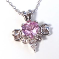 This glittering Magical Girl Necklace features a pastel pink cubic zirconia stone shaped as a heart with white sapphire accent stones. The tiny crescent moon and star details complete this celestial necklace. She has a complimentary 18” chain, with extender, and comes in plated gold, rose gold, or rhodium. The order will take 1 - 2 weeks to package + shipping time. Tiffany Pendant, Ethereal Jewelry, Crescent Moon And Star, Prom Necklaces, Fancy Watches, Tiffany Necklace, Girl Necklace, Cleaning Silver Jewelry, Celestial Necklace