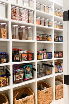 an organized pantry with baskets and food items