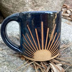 Solstice sun ceramic mug Pottery Inspired By Nature, Glaze Designs For Pottery, Ceramics Ideas Pottery Mug, Carved Pottery Mugs, Simple Mug Designs, Handmade Ceramics Ideas Pottery, Pottery Mugs Handmade, Ceramic Mug Designs, Sgraffito Designs