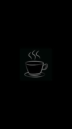 a coffee cup with steam rising out of it on a saucer in the dark